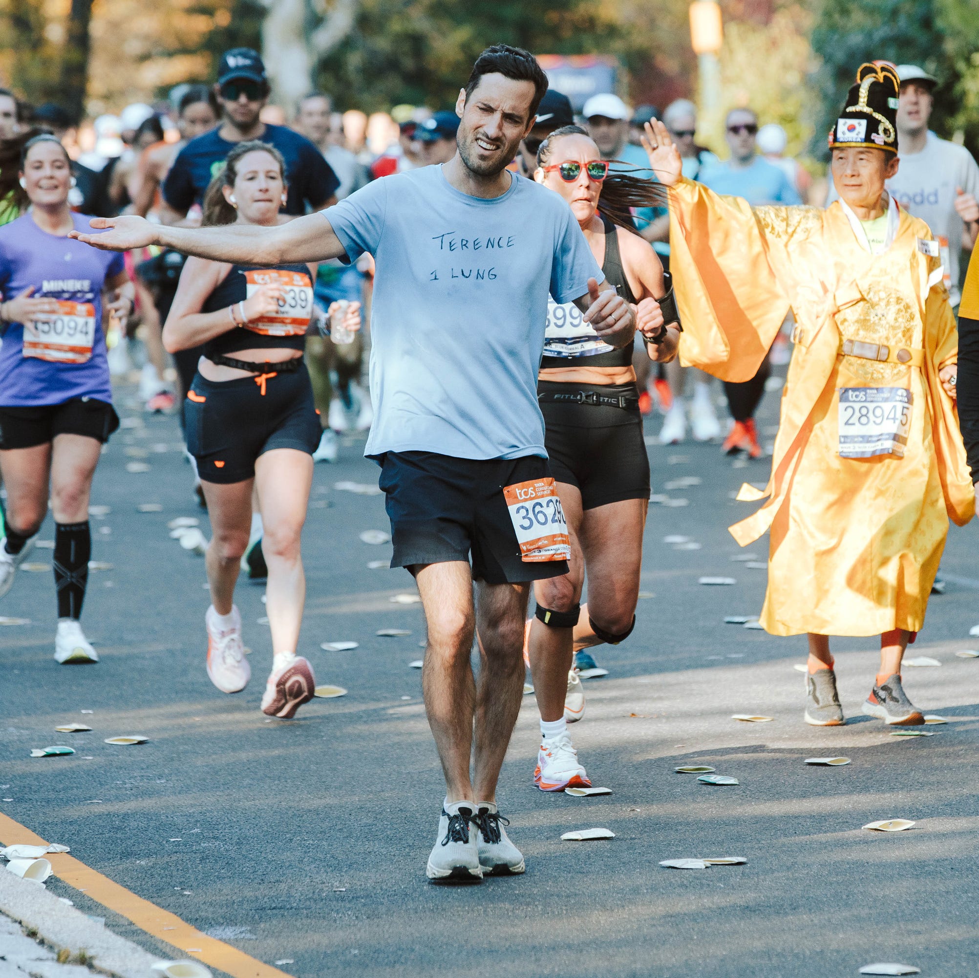 runners in a marathon on city streets runners in a marathon on city streets