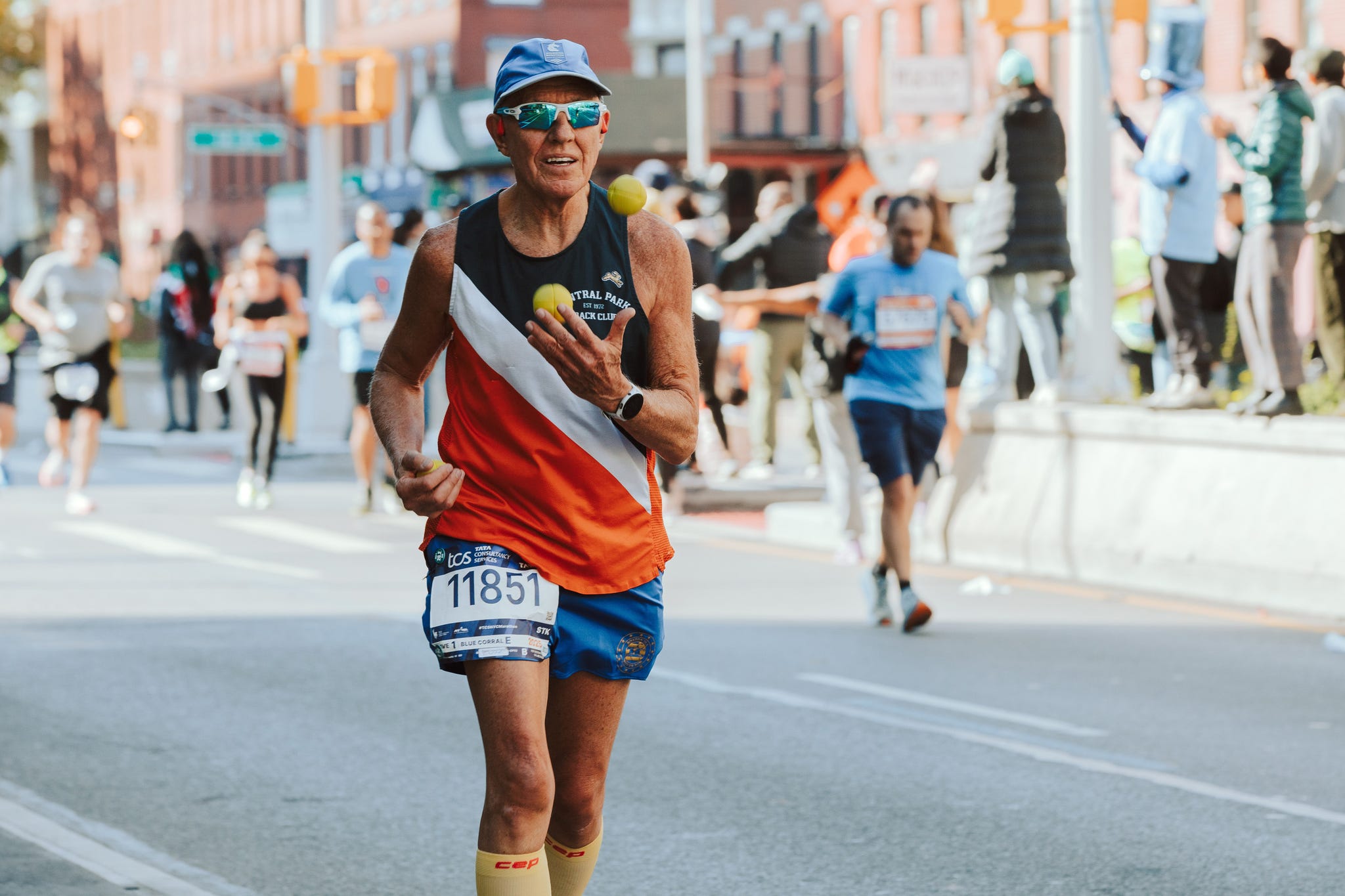 runners in a marathon on city streets runners in a marathon on city streets