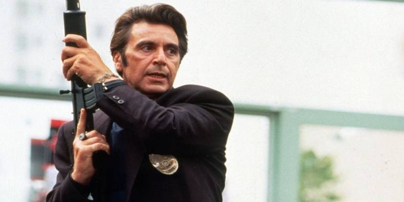 Al Pacino holding a machine gun in Heat