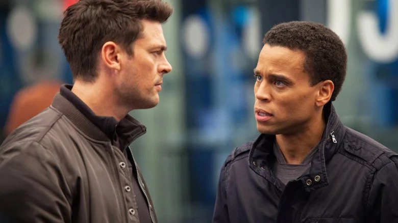Dorian (Michael Ealy) looks shocked at an impassive John Kennex (Karl Urban) in Almost Human