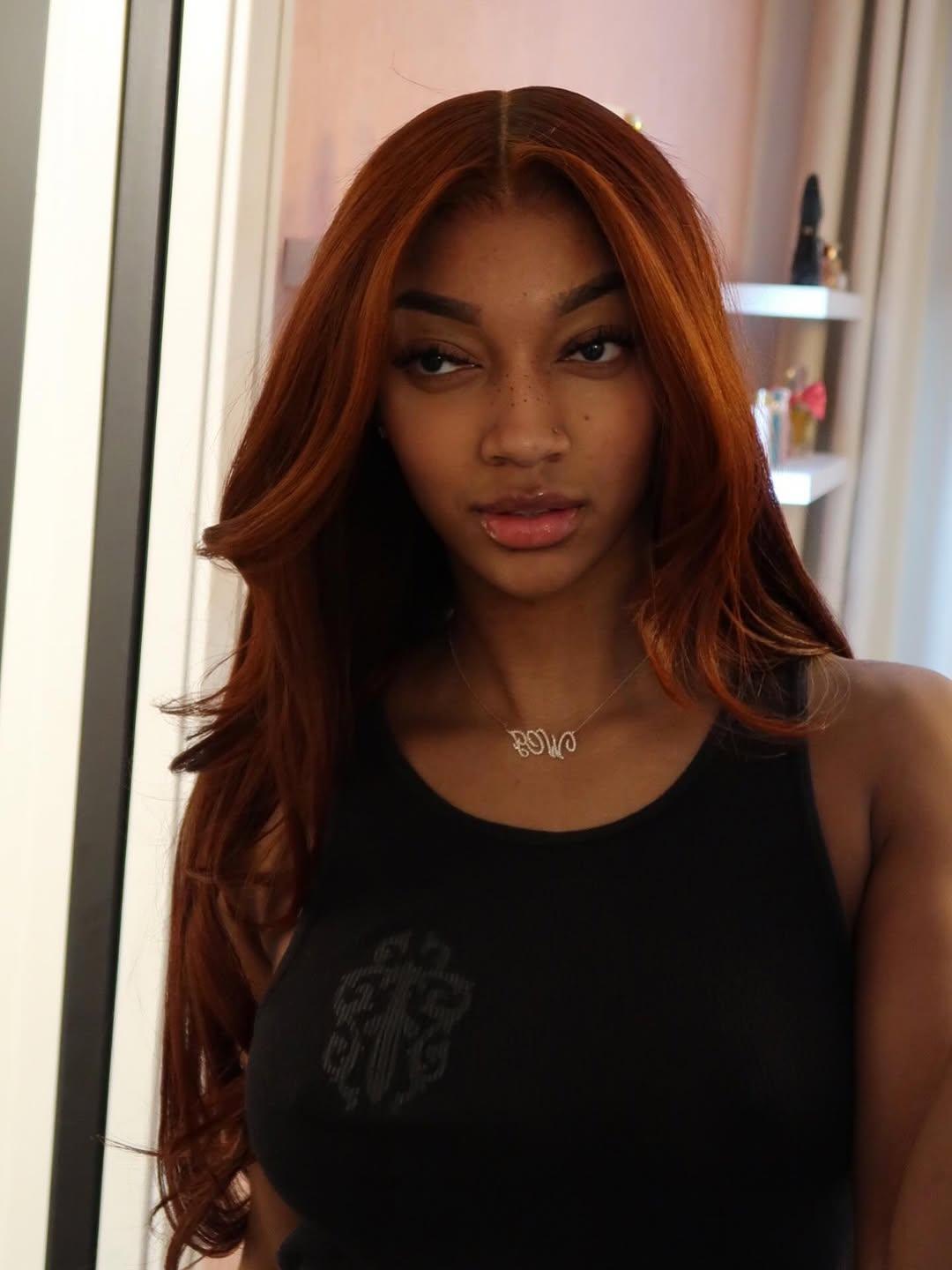 Angel Reese taking a selfie.