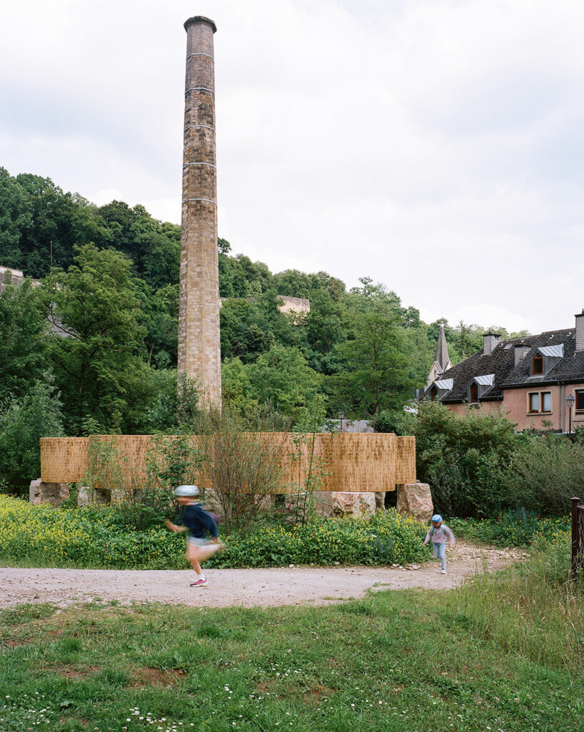 atelier faber stacks reeds over luxembourg sandstone to revive soil porosity on old well site