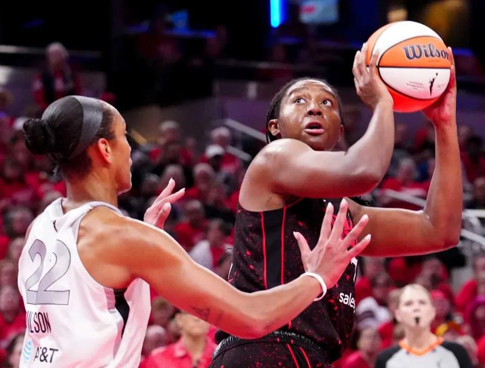 Las Vegas Aces center A'ja Wilson (22) defends Indiana Fever forward Aliyah Boston (7) as she shoots during Game 4 of the WNBA semifinals.Christine Tannous/IndyStar / USA TODAY NETWORK via Imagn Images