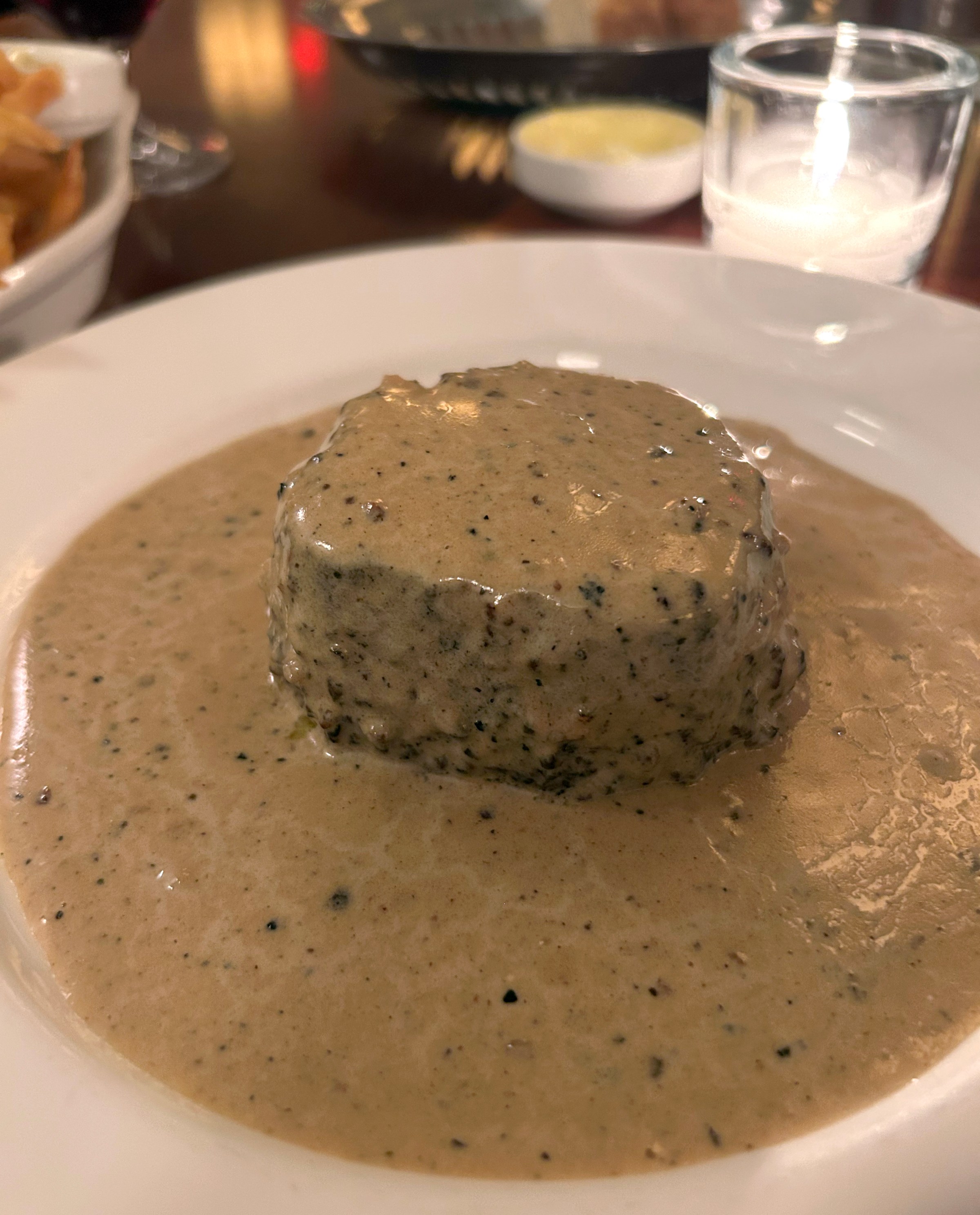 A steak with brown sauce.