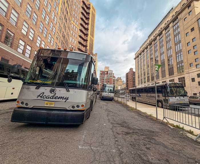 several buses on a street