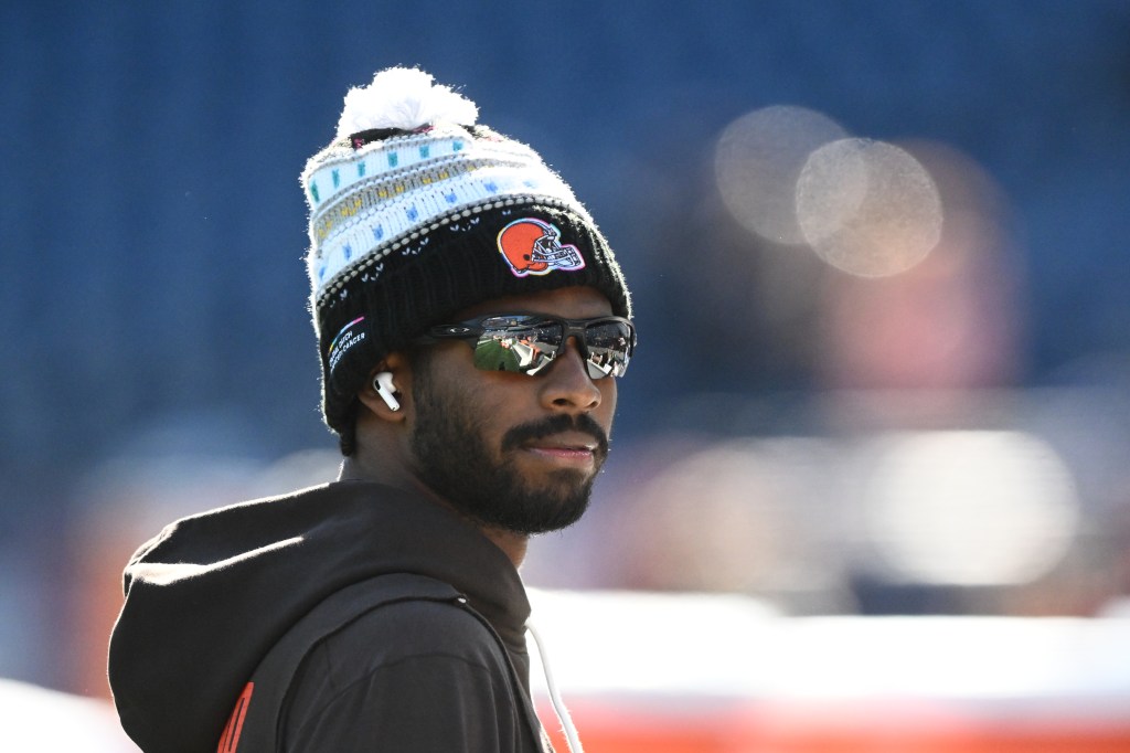 Browns quarterback Shedeur Sanders (12) looks on during warm up prior to the game against the New England Patriots at Gillette Stadium. 