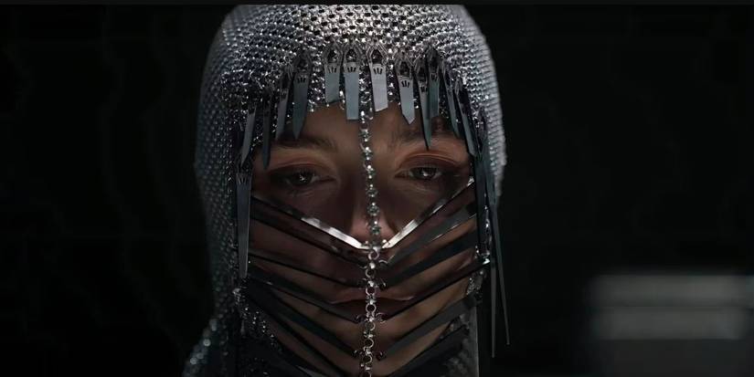 Close-up of Florence Pugh as Princess Irulan in Dune: Part Two against a dark background