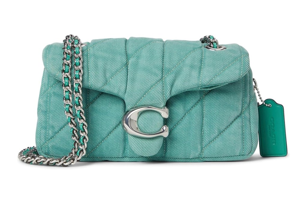 Light blue quilted Coach shoulder bag with silver chain strap and "C" logo clasp.
