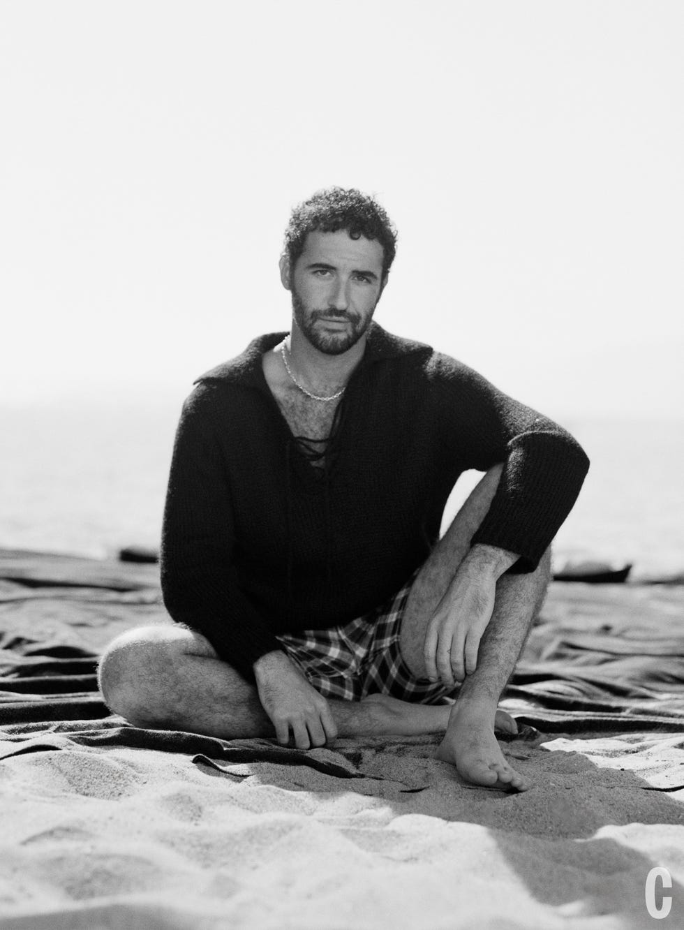 jordan firstman sitting on the beach