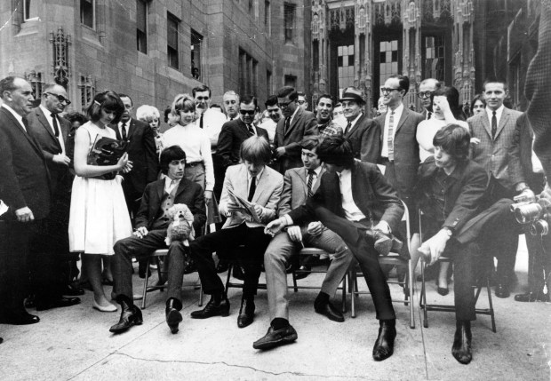 The Rolling Stones at a June 1964 news conference in front of Tribune Tower in Chicago saw Bill Wyman, from left, Brian Jones, Charlie Watts, Keith Richards and Mick Jagger slouching in their folding chairs. (Chicago Tribune historical photo)