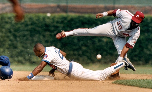 Chicago Cubs center fielder Jerome Walton steals second base as the throw bounces away from the Philadelphia Phillies' Steve Jeltz during a game on Aug. 12, 1989, at Wrigley Field. The Cubs won 9-7. (Ed Wagner/Chicago Tribune) 
