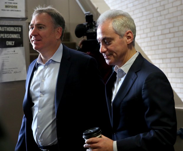 Ken Griffin, left, and then-Chicago Mayor Rahm Emanuel arrive at a Chicago Police Department Strategic Decisions Support Center on April 11, 2018. (Nancy Stone/Chicago Tribune)