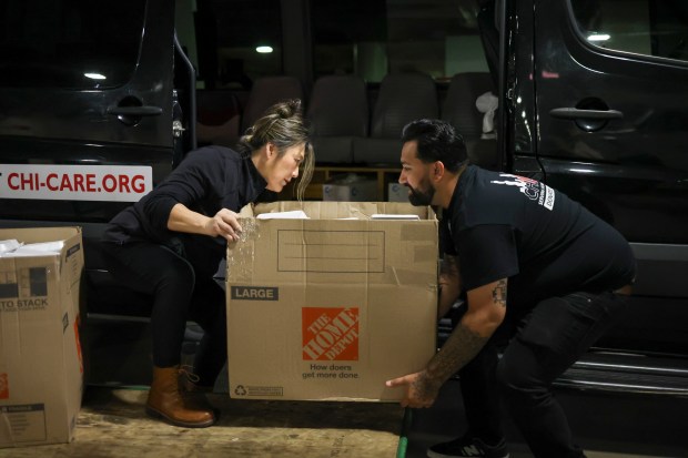 Fight2Feed founder Jiwon McCartney, left, and Chi-Care project manager Adam...