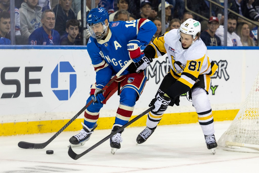 Rangers center Vincent Trocheck (16) is defended by the Penguins' Ben Kindel on Oct. 7, 2025.