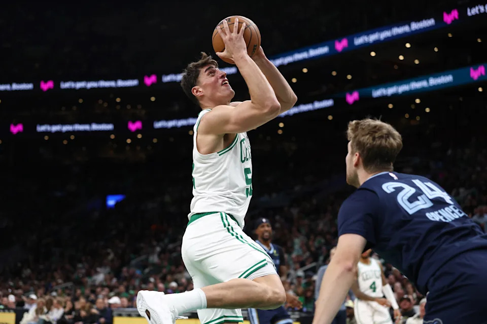 Nov 12, 2025; Boston, Massachusetts, USA; Boston Celtics center Luka Garza (52) shoots against the Memphis Grizzlies during the second half at TD Garden. Mandatory Credit: Winslow Townson-Imagn Images
