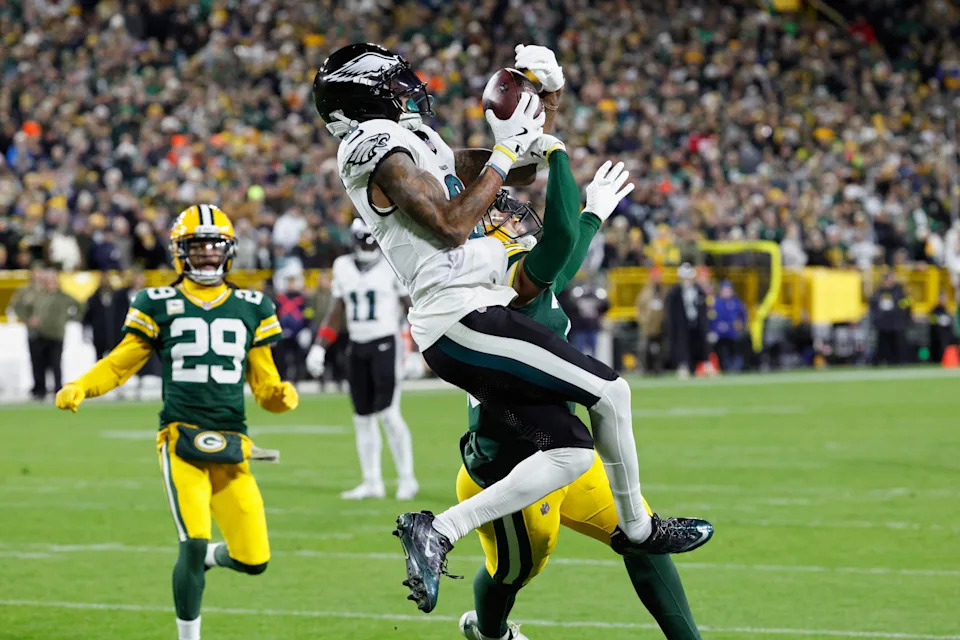 Philadelphia Eagles wide receiver DeVonta Smith (6) catches a pass for a touchdown against the Green Bay Packers during the second half of an NFL football game Monday, Nov. 10, 2025, in Green Bay, Wis. (AP Photo/Mike Roemer)