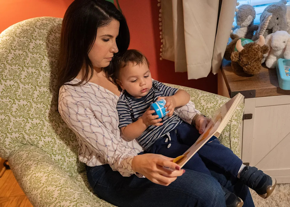 Christy Houvouras, 37, reads to her son before bedtime in Huntington, West Virginia.