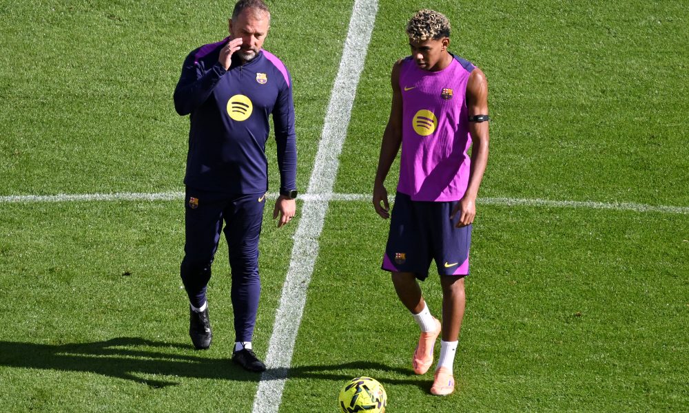Hansi Flick of FC Barcelona with Lamine Yamal