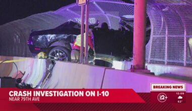 Vehicle crashes, dangles off overpass in Phoenix