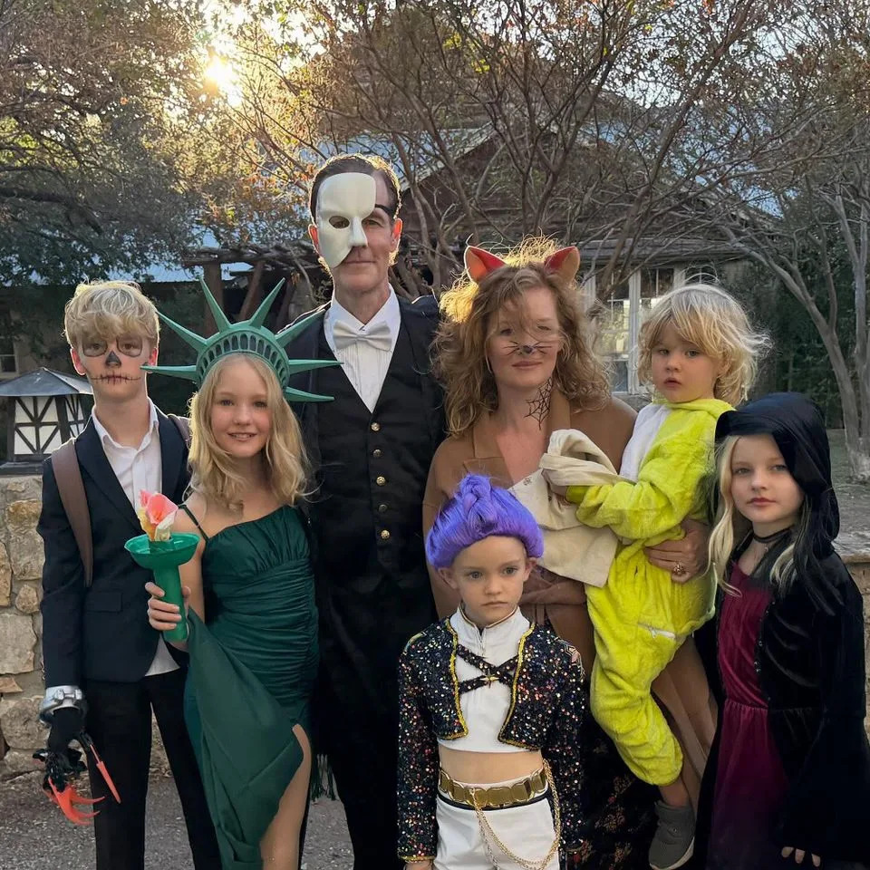 Kimberly Van Der Beek/Instagram James Van Der Beek poses with wife Kimberly and their six kids on Halloween 2025