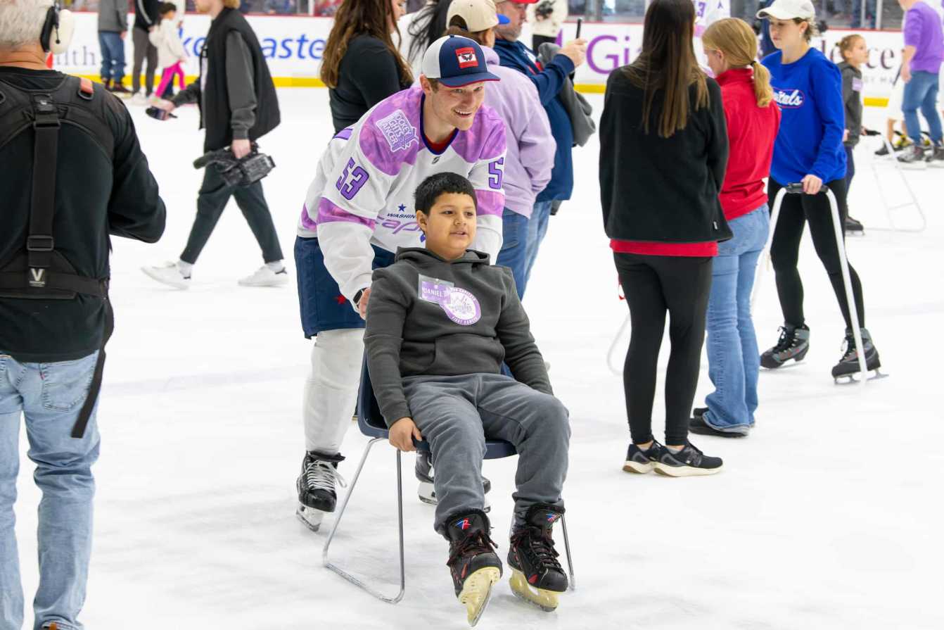 Ethen Frank and Daniel P. on the ice during the Hockey Fights Cancer skate.