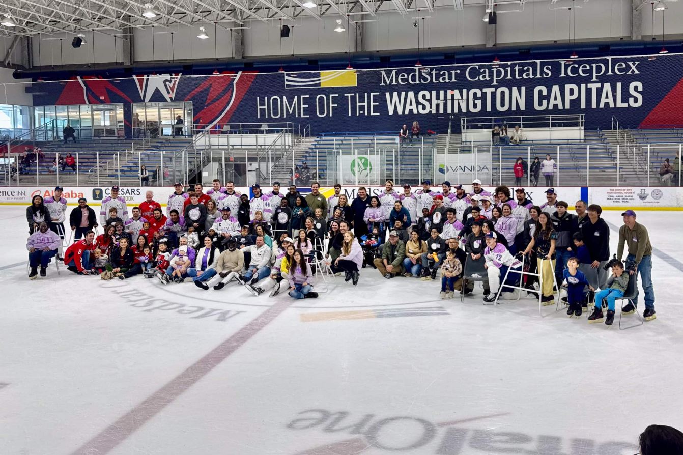A group photo from the Capitals' Hockey Fights Cancer skate.