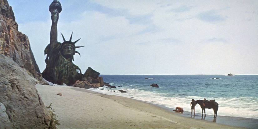 A man collapses on a beach in grief seeing ruins of The Statue of Liberty in Planet of the Apes, 1968.