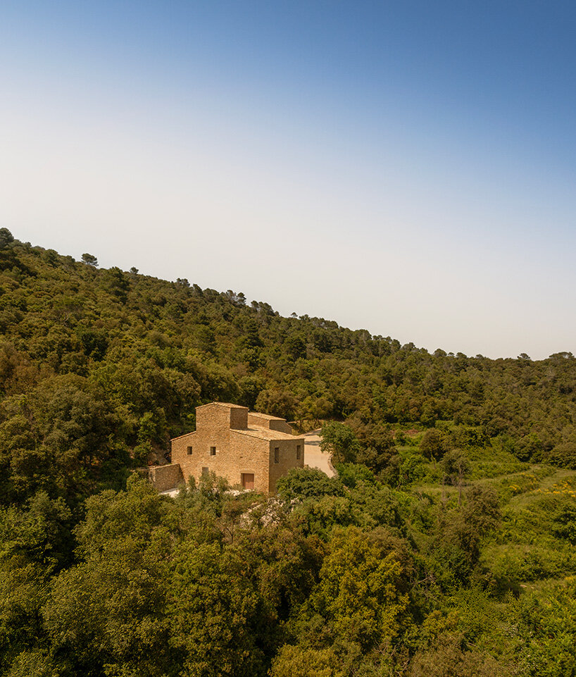 fran silvestre restores limestone farmhouse in spain as off-grid home and workspace
