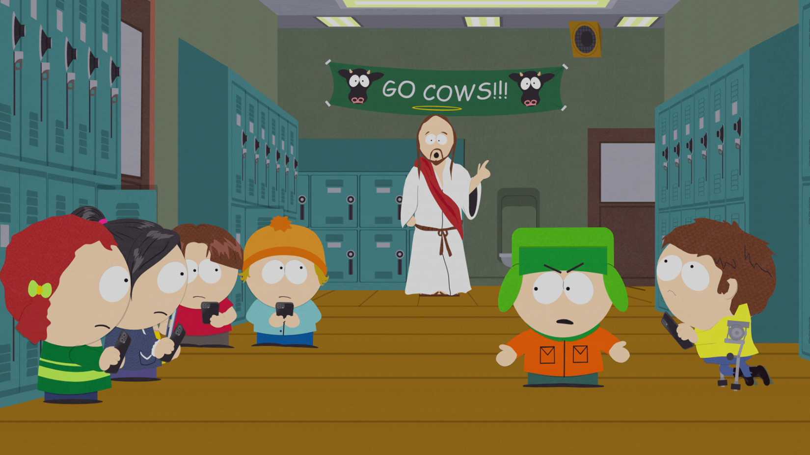 Kyle arguing with other students while Jesus stands in the background in South Park season 27 episode 5