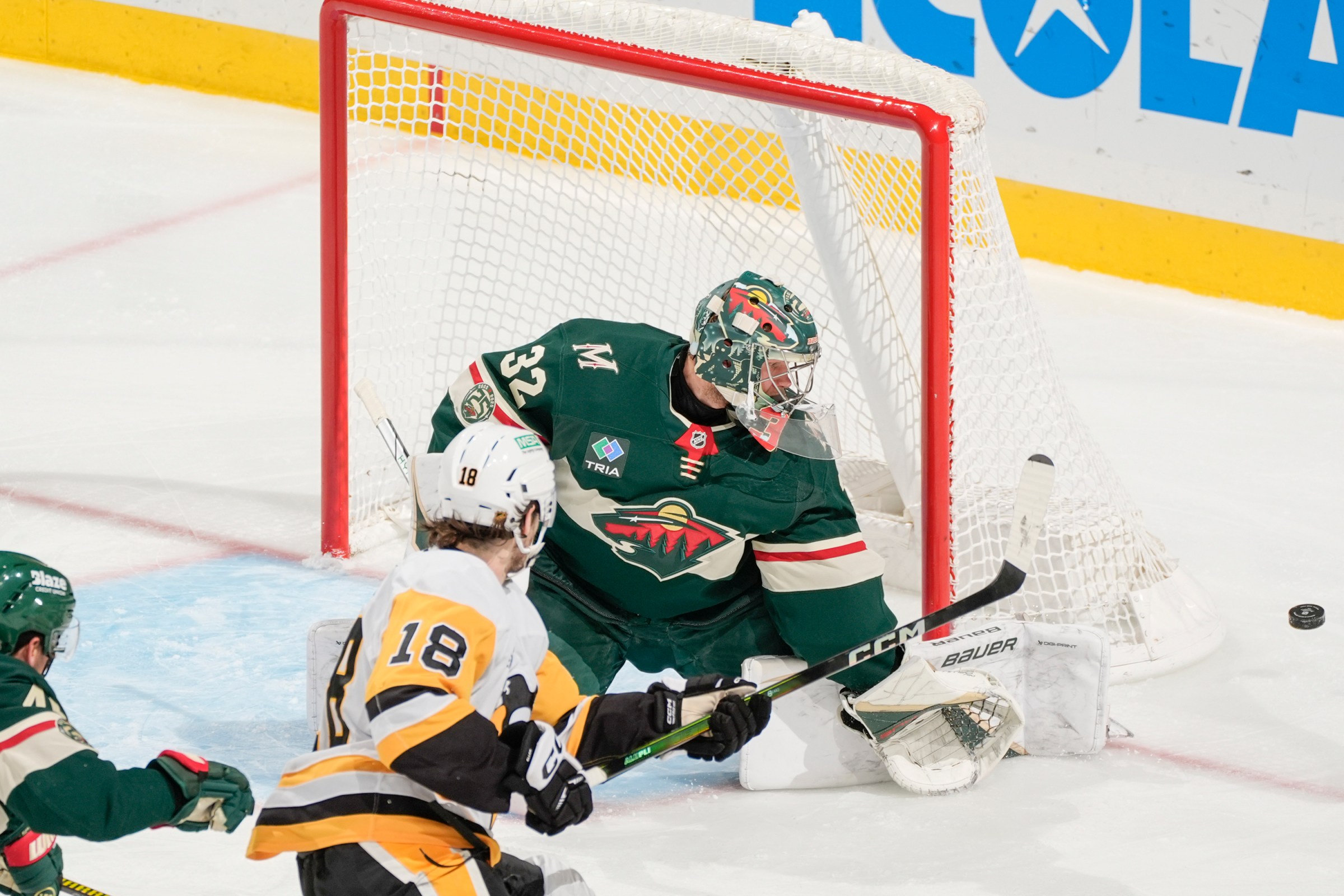SAINT PAUL, MN - OCTOBER 30: Filip Gustavsson #32 of the Minnesota Wild makes a save against Tommy Novak #18 of the Pittsburgh Penguins during the game at Grand Casino Arena on October 30, 2025 in Saint Paul, Minnesota. (Photo by Bruce Kluckhohn/NHLI via Getty Images)