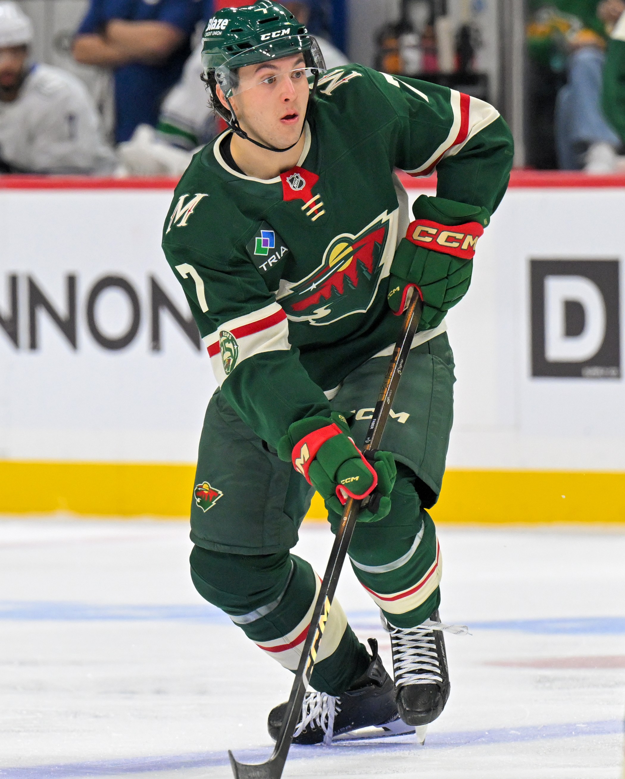 SAINT PAUL, MN - NOVEMBER 01: Minnesota Wild defensemen Brock Faber (7) controls the puck during a NHL game between the Minnesota Wild and Vancouver Canucks on November 1, 2025, at Grand Casino Arena in Saint Paul, MN. (Photo by Nick Wosika/Icon Sportswire via Getty Images)