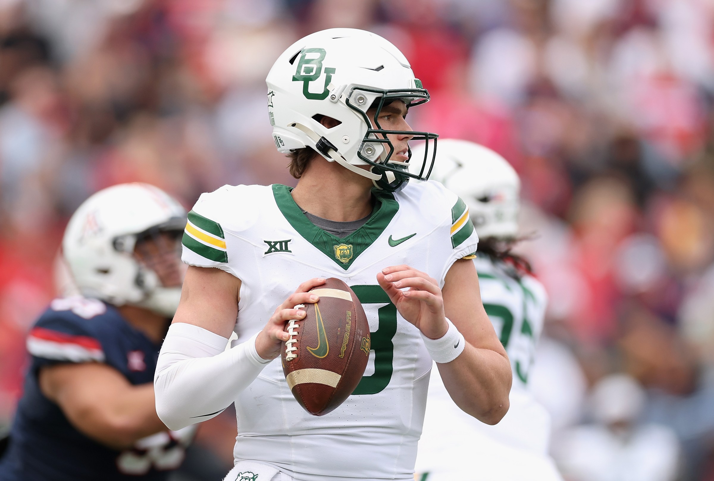 TUCSON, ARIZONA - NOVEMBER 22: Sawyer Robertson #13 of the Baylor Bears drops back to pass during the second half of the NCAAF game against the Arizona Wildcats at Casino Del Sol Stadium on November 22, 2025 in Tucson, Arizona. The Wildcats defeated the Bears 41-17. (Photo by Christian Petersen/Getty Images)