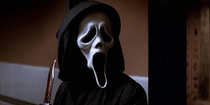 Ghostface standing in the school hallway in Scream