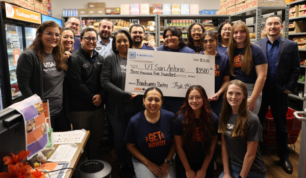 UT San Antonio students and staff join GM Financial to celebrate the company’s donation to the Roadrunner Pantry.