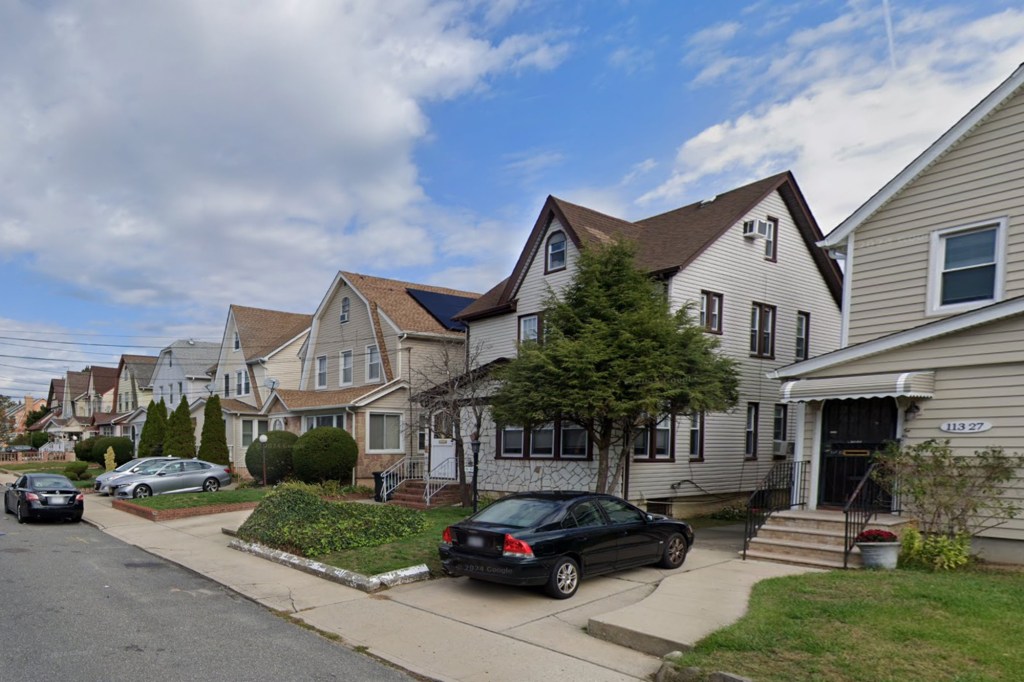 A Google Maps street view of 113-23 202nd St, Jamaica, Queens, a residential street with several houses and parked cars.