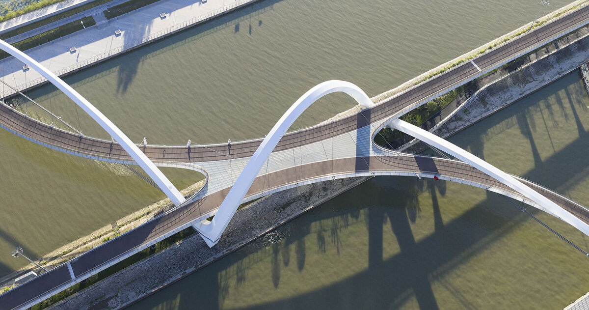 zaha hadid architects draws from silk embroidery with serpentine footbridge