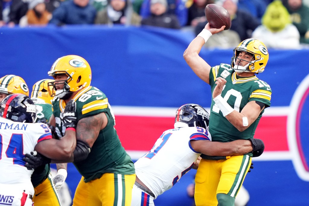 Green Bay Packers quarterback Jordan Love (10) throws a pass under pressure from New York Giants linebacker Abdul Carter (51).