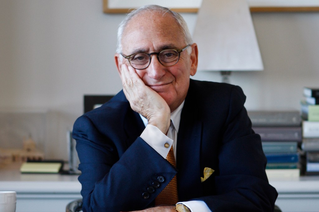 Robert A.M. Stern smiling while leaning on his hand.