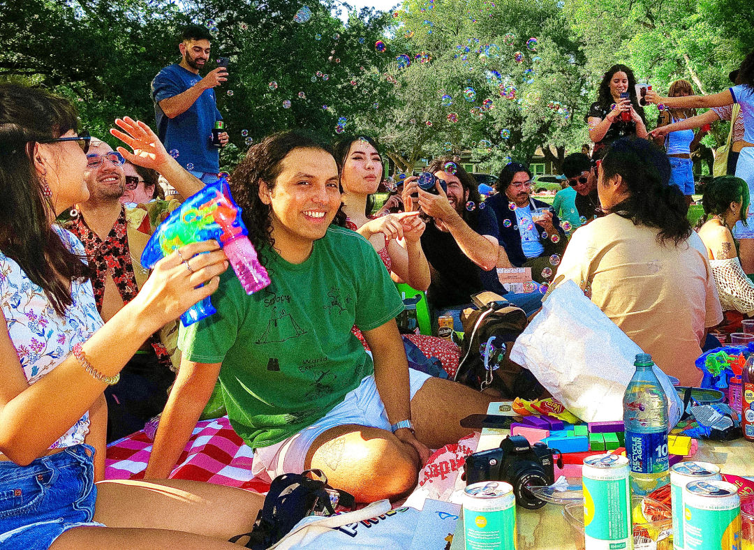 photo of people gathering on the Big Blanket, laughing and enjoying their company.
