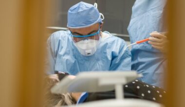 A dentist works on a patient at a practice in London