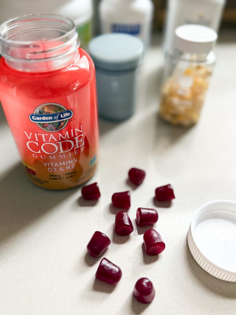 Vitamin D3 and K2 gummy supplements in a bottle.
