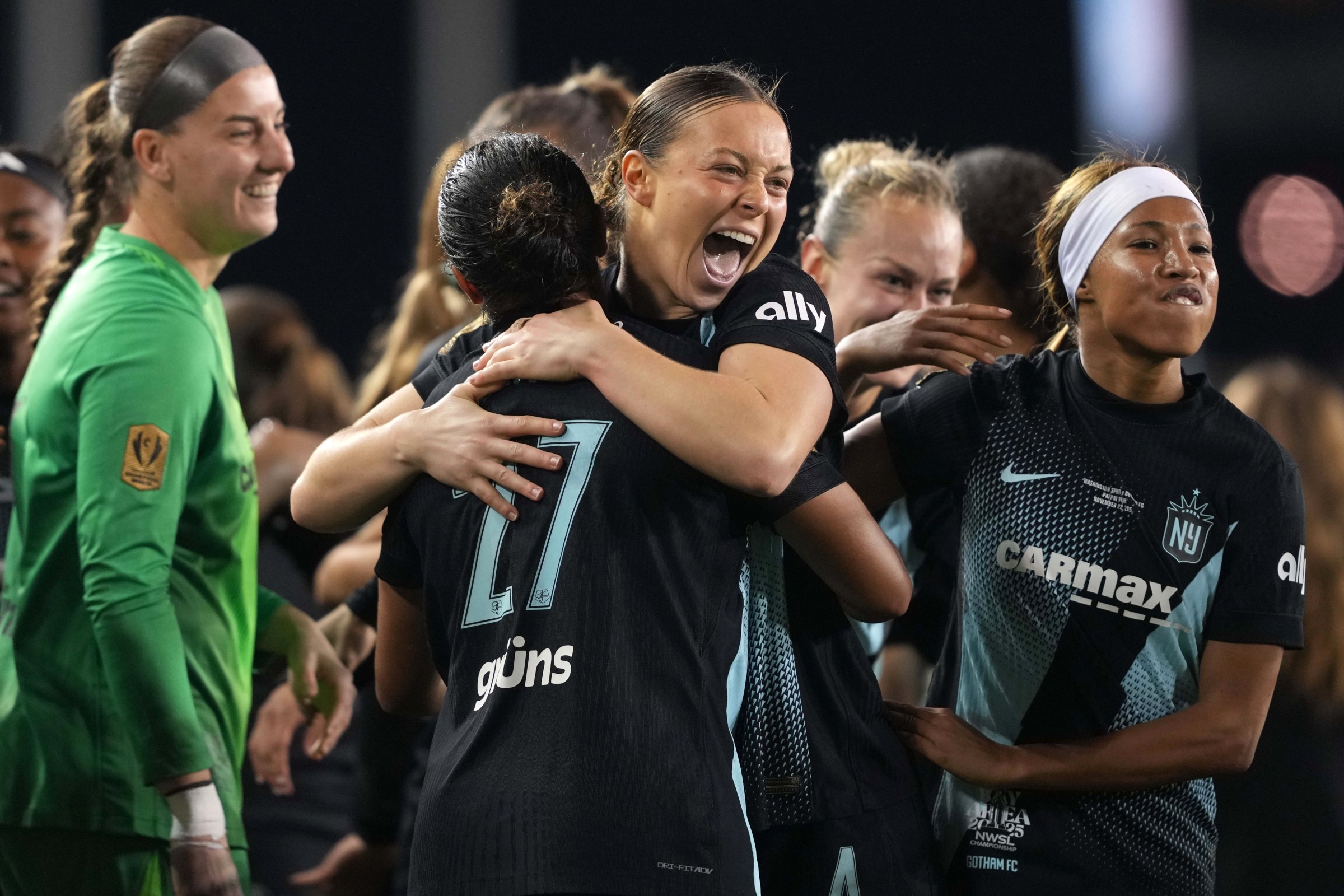 Nov 22, 2025; San Jose, California, USA; Gotham FC defender Lilly Reale (4) celebrates with defender Jess Carter (27) after defeating the Washington Spirit in the 2025 NWSL Championship at PayPal Park. Mandatory Credit: Darren Yamashita-Imagn Images