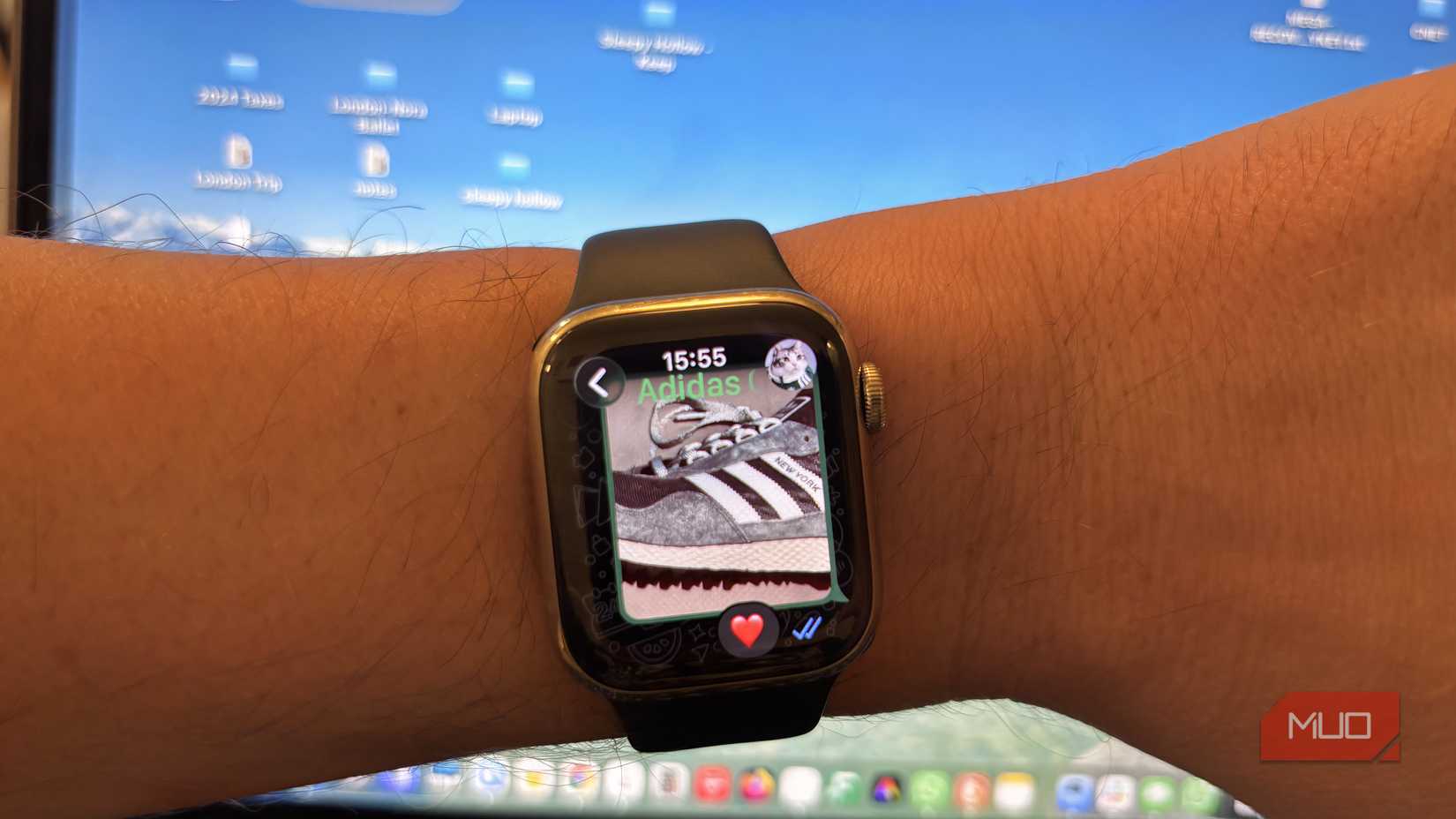 Apple Watch Series 8 with WhatsApp open showing an image of a sneaker and a heart emoji reaction