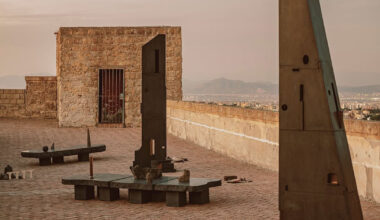 totemic sculptures compose volcanic stone installation in naples