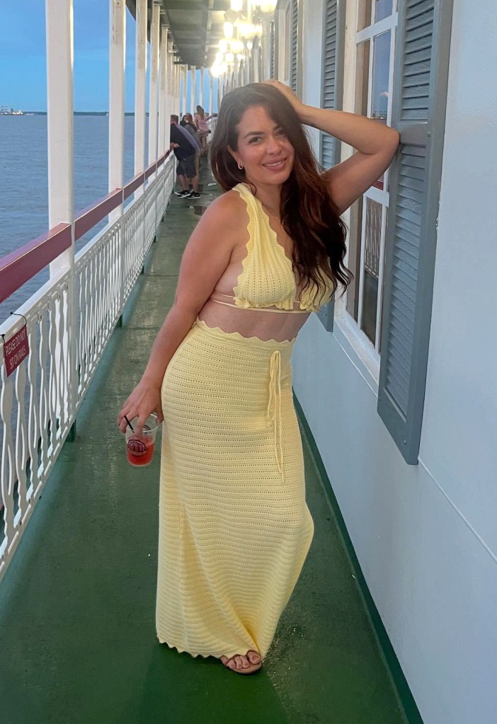 Roxanna Valenzuela, mayor of South Tucson, AZ, in a light yellow two-piece outfit holding a drink on a boat deck.