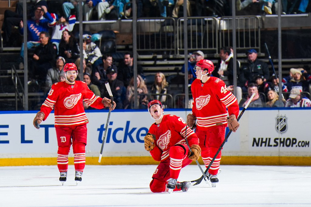 Lucas Raymond of the Detroit Red Wings celebrating after scoring a goal.