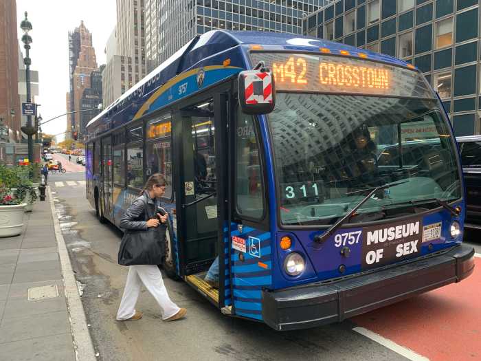 people boarding a NYC bus