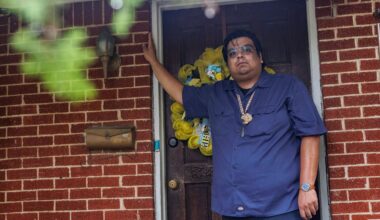 Cristo Mendoza stands in the doorway of his family's home in Southeast Dallas.