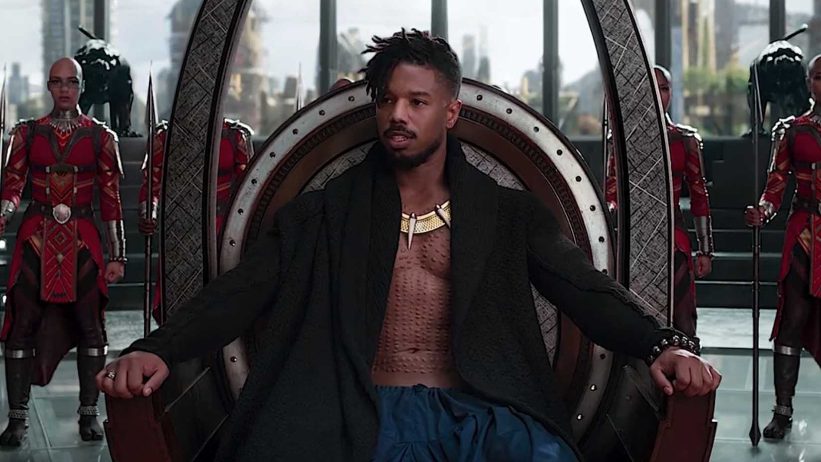 Michael B. Jordan as Killmonger sitting on the throne of Wakanda in Black Panther