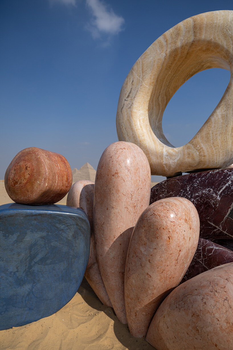 monumental sculptures in marble, onyx, travertine and quartzite emerge at the giza pyramids